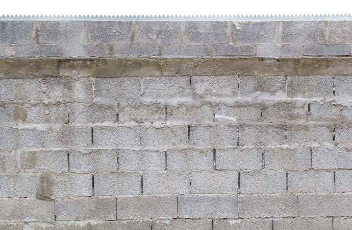 Étapes de pose d’une clôture en blocs béton par Avenir Rénovations